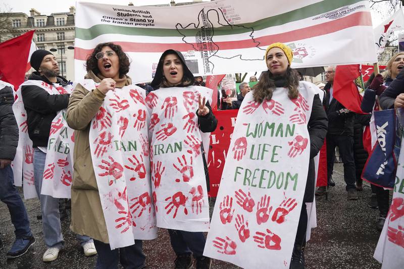 Protesters at Marble Arch in London before matching to Trafalgar Square to protest against the Iranian regime on Sunday. PA via AP