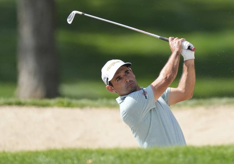 Fabrizio Zanotti of Paraguay plays a bunker shot on the first hole. AP