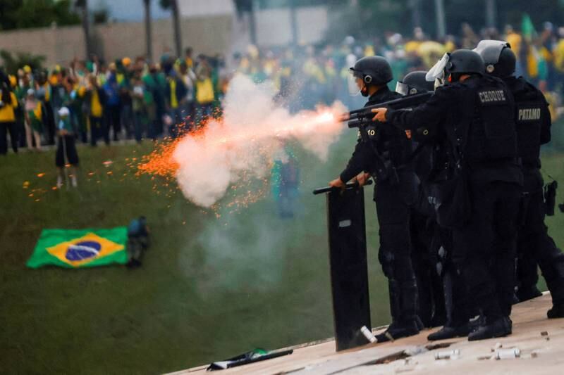 The security forces take action as supporters of Jair Bolsonaro demonstrate outside Brazil’s National Congress building in Brasilia. Reuters