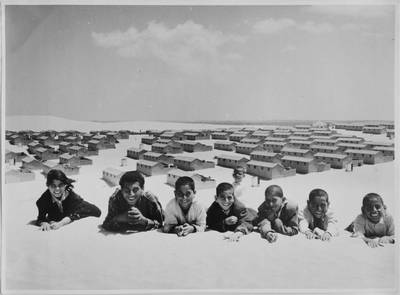 In this 1971 photo from the UNRWA archive, Palestinian refugees pose for a picture in the New Amman refugee camp in Eastern Jordan. AP Photo/G.Nehmeh, UNRWA Photo Archives