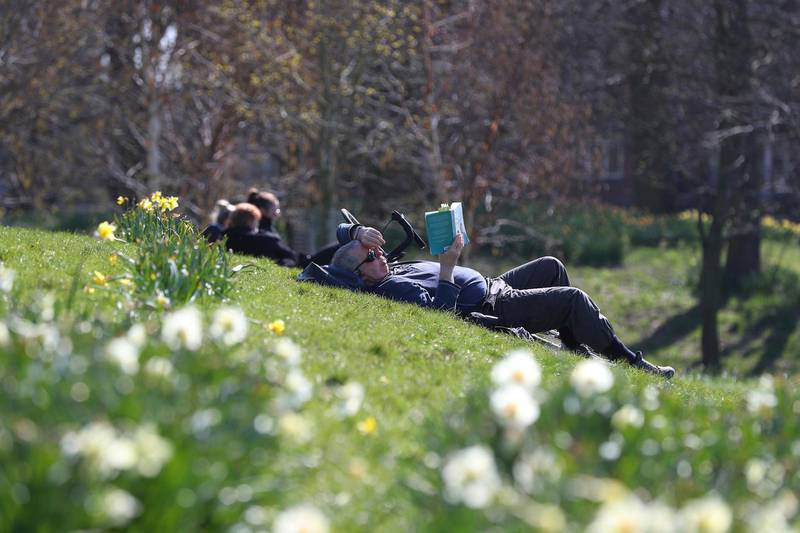 People enjoy the sunny weather in Sefton Park, Liverpool. AP Photo