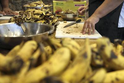 Volunteers chopping more banana skins to cook for dessert, credit Peter Yeung.jpg