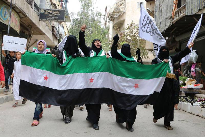 Female supporters of the Al Nusra Front take part in a protest against Syrian President Bashar Al Assad. Baraa Al Halabi/ AFP Photo