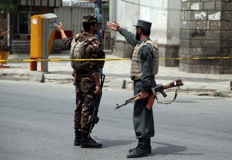 Afghan security personnel attend the site of a huge explosion in Kabul, Afghanistan. AP Photo