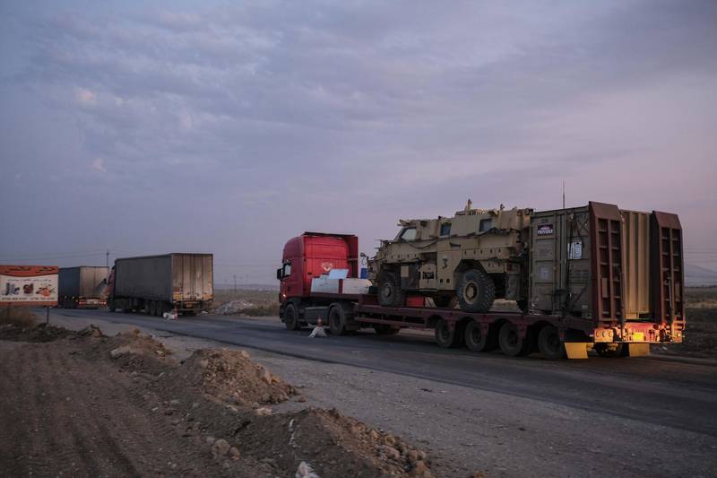 A convoy of U.S. armored military vehicles leave Syria on a road to Iraq. Getty Images
