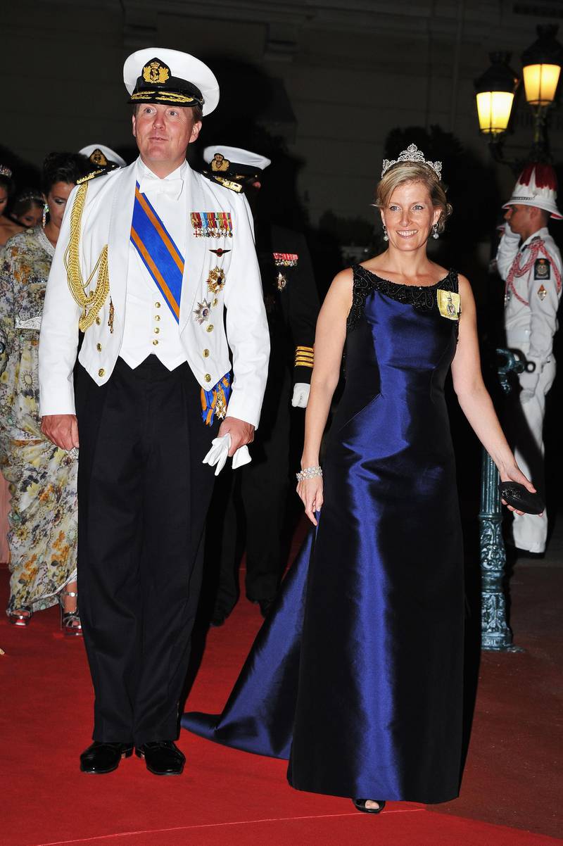 MONACO - JULY 02:  Crown Prince Willem-Alexander of Netherlands (L) and Sophie Countess of Wessex attend a dinner at Opera terraces after the religious wedding ceremony of Prince Albert II of Monaco and Princess Charlene of Monaco on July 2, 2011 in Monaco. The Roman-Catholic ceremony followed the civil wedding which was held in the Throne Room of the Prince's Palace of Monaco on July 1. With her marriage to the head of state of the Principality of Monaco, Charlene Wittstock has become Princess consort of Monaco and gains the title, Princess Charlene of Monaco. Celebrations including concerts and firework displays are being held across several days, attended by a guest list of global celebrities and heads of state.  (Photo by Pascal Le Segretain/Getty Images)