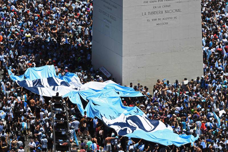 Argentina fans wait for the bus parade. AFP