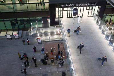 Travelers stand in line for Covid-19 tests after arriving at Heathrow Airport. Bloomberg