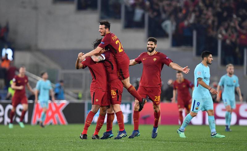 Roma players celebrate victory over Barcelona at the end of their Uefa Champions League quarter-final second-leg match in Rome. Ettore Ferrari / EPA