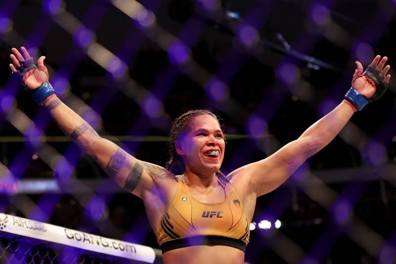 Amanda Nunes celebrates after defeating Julianna Pena in their bantamweight title bout at UFC 277. Getty
