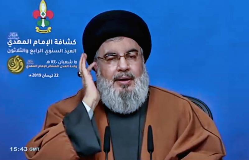 epa07521731 A TV grab handout photo from Hezbollah's al-Manar TV shows Hezbollah leader Sayyed Hassan Nasrallah giving a speech during the 34th anniversary for Hezbollah al-Mahdi scouts, in southern Beirut, Lebanon, 22 April 2019. Nasrallah called the sanctions on Iran, Syria and Venezuela It is an aggression against free peoples. Hezbollah Secretary-General Sayyed Hassan Nasrallah said that Syria's enemies are trying to implement their aggressive plans through unilateral economic measures after failing to achieve them through terrorism and military aggression.  EPA/AL-MANAR TV GRAB HANDOUT  HANDOUT EDITORIAL USE ONLY/NO SALES