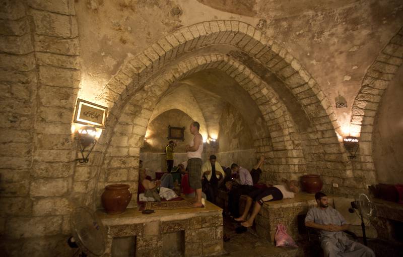 Palestinians relax at the Hamam AL Sammara Public Baths during preparations for the Eid Al Fitr feast in Gaza City. AFP