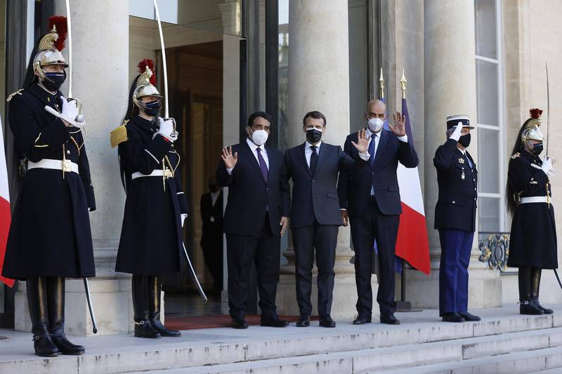 epa09092148 French President Emmanuel Macron (C) welcomes Head of Libya's Presidential Council, Mohamed al-Menfi (L) and Vice President of Libya's Presidential Council, Musa Al-Koni (R) for a meeting at Elysee Palace in Paris, France, 23 March 2021.  EPA/IAN LANGSDON
