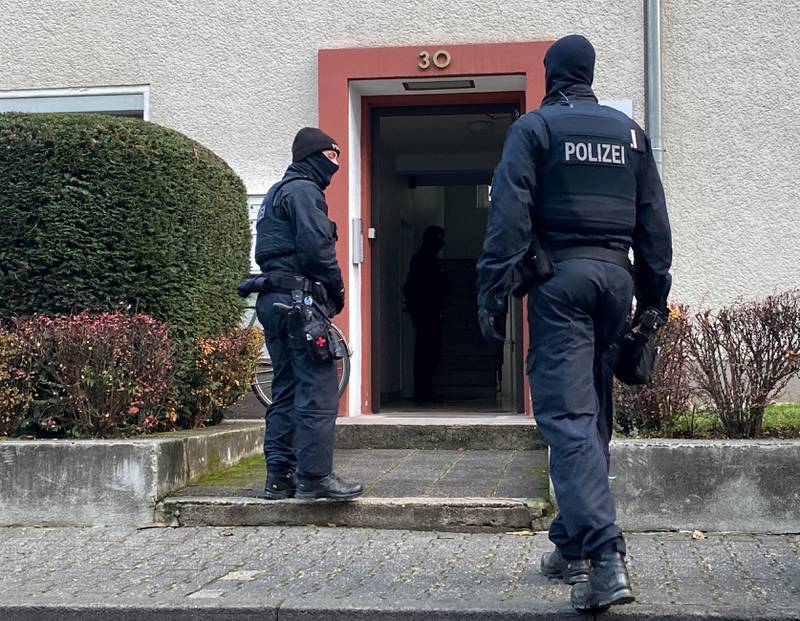Police enter a property in Frankfurt. Reuters
