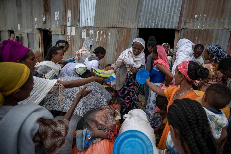 Displaced Tigrayans queue to receive food donated by local residents at a reception center for the internally displaced in Mekele, in the Tigray region of northern Ethiopia. AP Photo