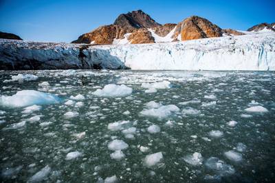 TO GO WITH AFP PACKAGE : Fifth anniversary of Paris Agreement on climate change -(FILES) In This file photo taken on August 17, 2019 shows bergy bits and growlers floating in front of the Apusiajik glacier, near Kulusuk (aslo spelled Qulusuk), a settlement in the Sermersooq municipality located on the island of the same name on the southeastern shore of Greenland.  / AFP / Jonathan NACKSTRAND / TO GO WITH AFP PACKAGE : Fifth anniversary of Paris Agreement on climate change -
