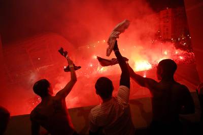 PSG players celebrate at the top of the Parc des Prices as fans gather below. AFP