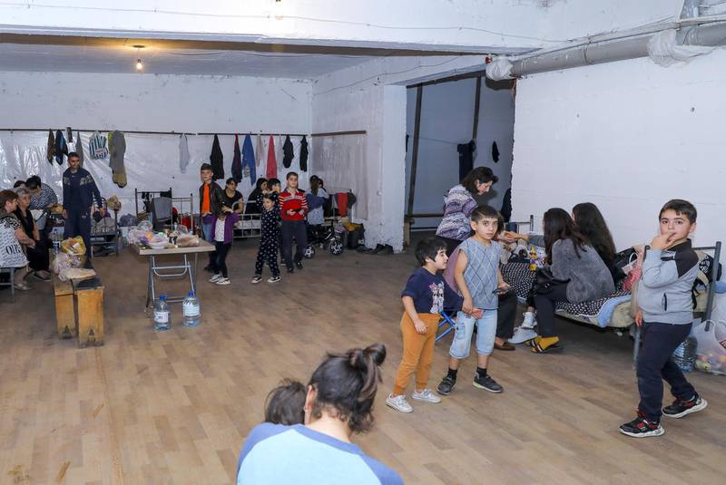 In this photo released by the Armenian Foreign Ministry, people gather in a bombshelter to protect against shelling in Stepanakert, the self-proclaimed Republic of Nagorno-Karabakh, Azerbaijan.  AP
