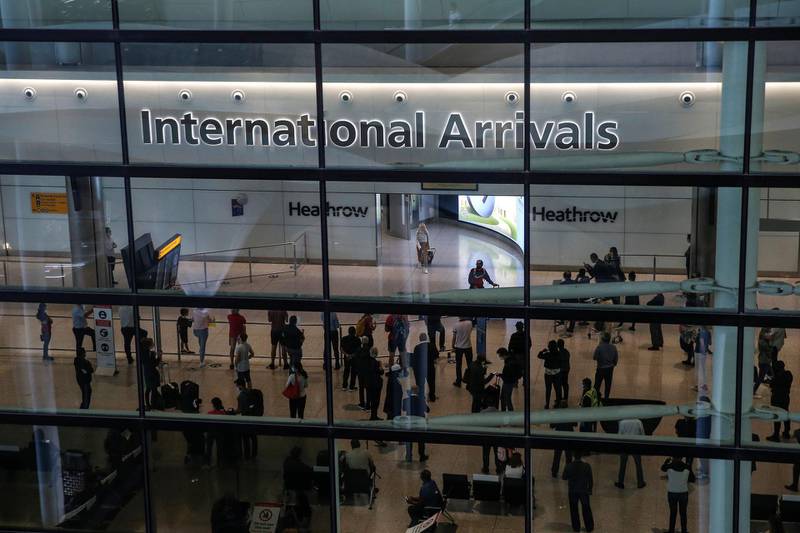LONDON, ENGLAND - AUGUST 22: Travellers arrive at Heathrow Airport Terminal 2 on August 22, 2020 in London, England. As of Saturday morning at 4am, travellers arriving in England from Austria, Croatia, and Trinidad and Tobago were required to quarantine themselves for 14 days. At the same time, travellers from Portugal were no longer required to quarantine. (Photo by Hollie Adams/Getty Images)