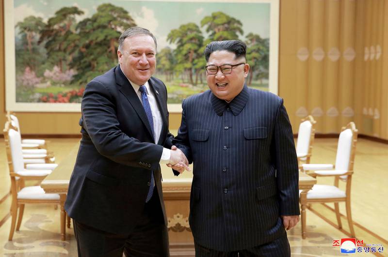 FILE PHOTO: North Korean leader Kim Jong Un shakes hands with U.S. Secretary of State Mike Pompeo in this May 9, 2018 photo released on May 10, 2018 by North Korea's Korean Central News Agency (KCNA) in Pyongyang.   KCNA/via REUTERS       ATTENTION EDITORS - THIS PICTURE WAS PROVIDED BY A THIRD PARTY. REUTERS IS UNABLE TO INDEPENDENTLY VERIFY THE AUTHENTICITY, CONTENT, LOCATION OR DATE OF THIS IMAGE. NO THIRD PARTY SALES. SOUTH KOREA OUT.