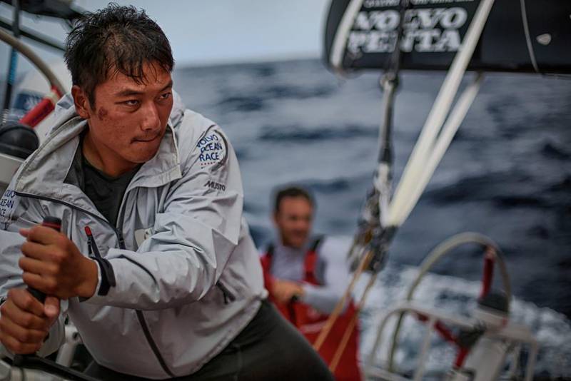 Jin Hao Chen trims the sails abord the Dongfeng Race Team boat. Yann Riou / Dongfeng Race Team / Volvo Ocean Race