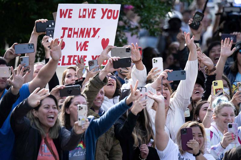 Fans cheer as US actor Johnny Depp arrives at the Fairfax County Circuit Courthouse in Fairfax, Virginia. AFP