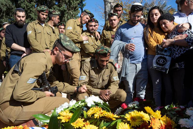 Israeli soldiers and friends of Sgt Yuval Mor Yosef during his funeral in the military cemetery in Ashkelon, southern Israel.  EPA