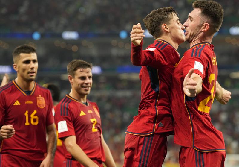Spain's Gavi, second right, celebrates with Spain's Aymeric Laporte after scoring his side's fifth goal. AP 
