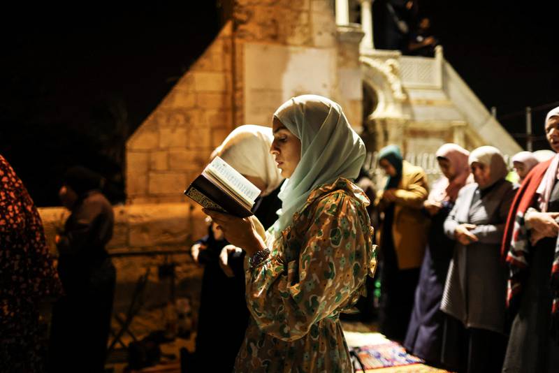 Palestinians pray. Reuters
