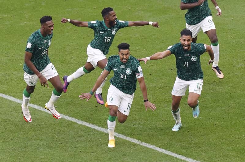 Salem Al Dawsari of Saudi Arabia, front, celebrates with teammates after scoring the second goal against Argentina during the 2022 World Cup at the Lusail Stadium on Tuesday, November 22, 2022. EPA
