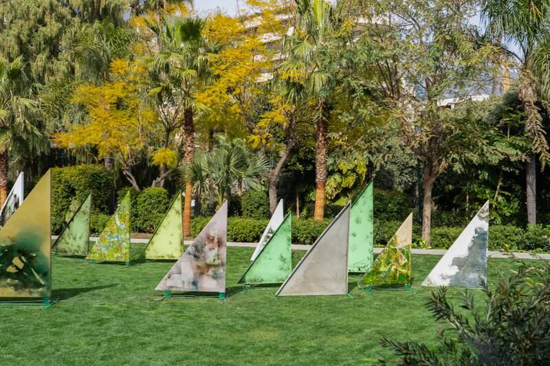 The 30 triangular metal sheets, resembling sailboats, have been painted and burned, causing the paint to bubble and take on new forms and colours. Photo: Studio Jean Boghossian