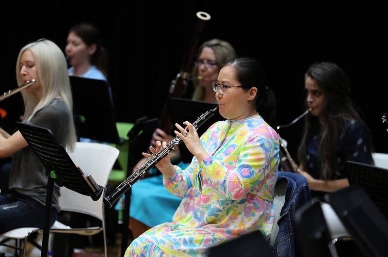 Aisulu Auzhanova from Kazakhstan plays the oboe during a rehearsal of the Firdaus Orchestra at a school in Dubai. Pawan Singh / The National