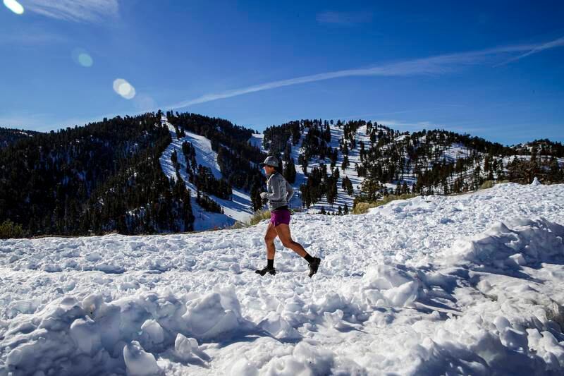 Adelina Zylker goes for a hike in snow along Table Mountain Road.