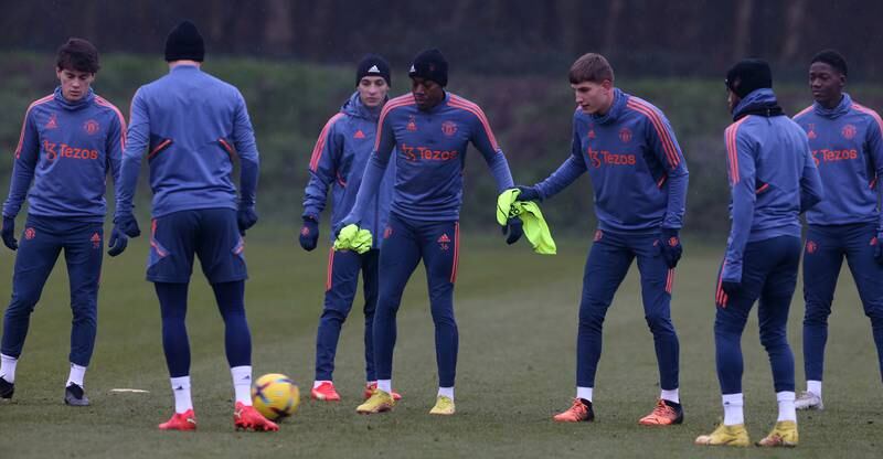 Anthony Elanga and Rhys Bennett with Manchester United  teammates during training. Getty