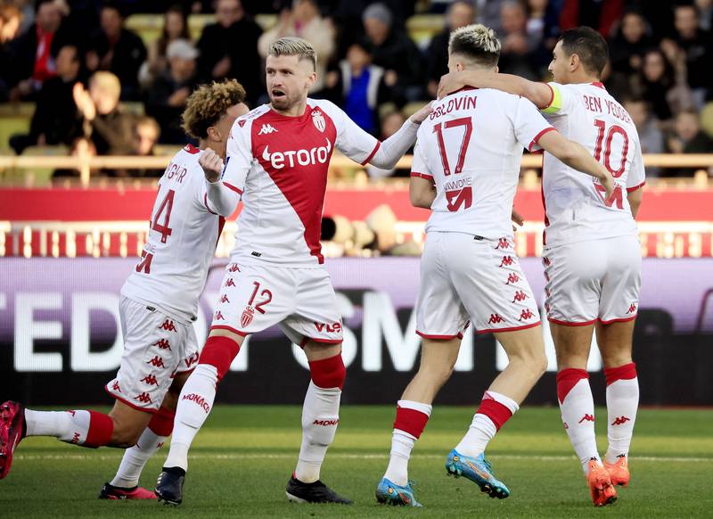 Monaco's Aleksandr Golovin (2R) is congratulated by teammates after scoring the first. AFP