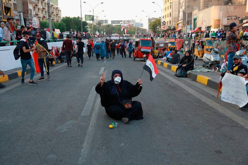 An Iraqi woman takes part in the anti-government protests in Baghdad. AP