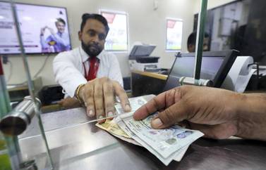 With global growth expected to rebound further in 2021, the World Bank estimates remittance flows to low- and middle-income countries to increase 2.6 per cent this year. Photo: Pawan Singh / The National     