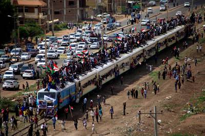 Sudanese civilians ride on the train to join in the celebrations of the signing of the Sudan's power sharing deal. REUTERS/Mohamed Nureldin Abdallah