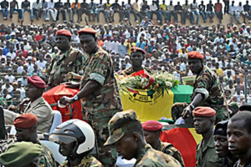 Guinean soldiers escort the coffin of Lansana Conté during yesterday's funeral ceremony in Conakry.