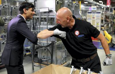 WORCESTER, ENGLAND - JULY 09: Chancellor of the Exchequer, Rishi Sunak greets an employee during a visit to the Worcester Bosch factory to promote the initiative, Plan for Jobs on July 9, 2020 in Worcester, England. (Photo by Phil Noble - WPA Pool/Getty Images)