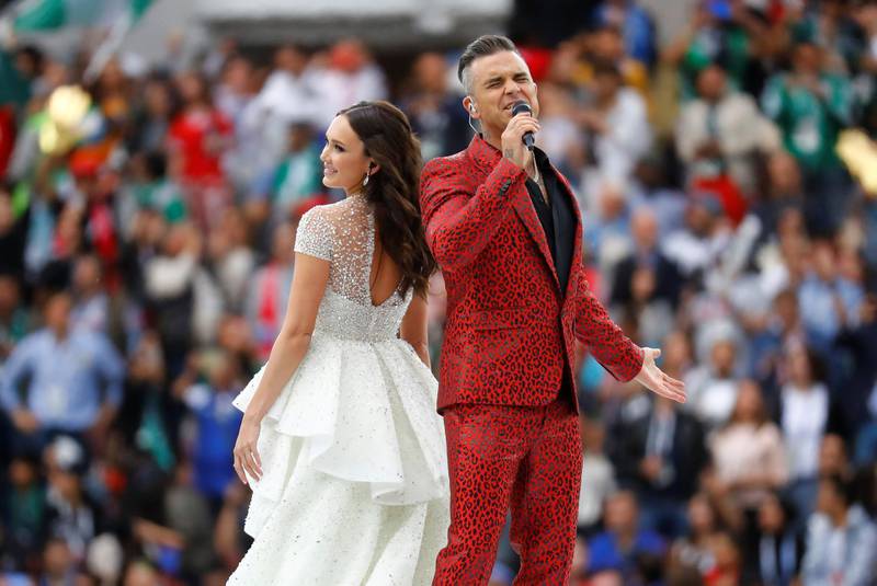 Robbie Williams and Aida Garifullina perform during the opening ceremony. Kai Pfaffenbach / Reuters