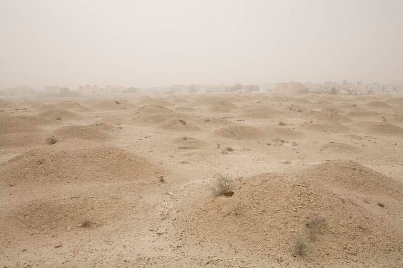 Bahrain - Manama - Jul 30 - 2009 : Aali Burial Mounds archaeological site with houses in the back. ( Jaime Puebla / The National )  *** Local Caption ***  JP QAL'AT AL -BAHRAIN 17.jpg