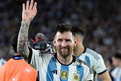 Argentina's forward Lionel Messi waves during a recognition ceremony for the World Cup winning team at the Monumental stadium in Buenos Aires Thursday. AFP