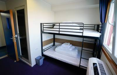 One of the 222 bedrooms on board the Bibby Stockholm accommodation barge at Portland Port in Dorset, which will house up to 500 asylum seekers. All photos: PA