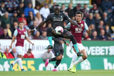 BURNLEY, ENGLAND - AUGUST 31: Sadio Mane of Liverpool is tackled by Jack Cork of Burnley  during the Premier League match between Burnley FC and Liverpool FC at Turf Moor on August 31, 2019 in Burnley, United Kingdom. (Photo by Jan Kruger/Getty Images)