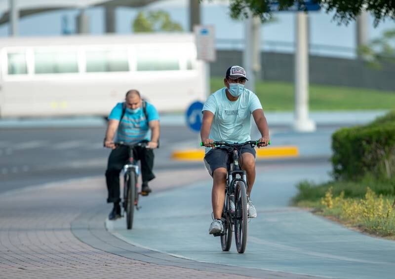 Cyclists on the Corniche in Abu Dhabi. A new permit system allows cyclists in the capital to ride over long distances in large groups.