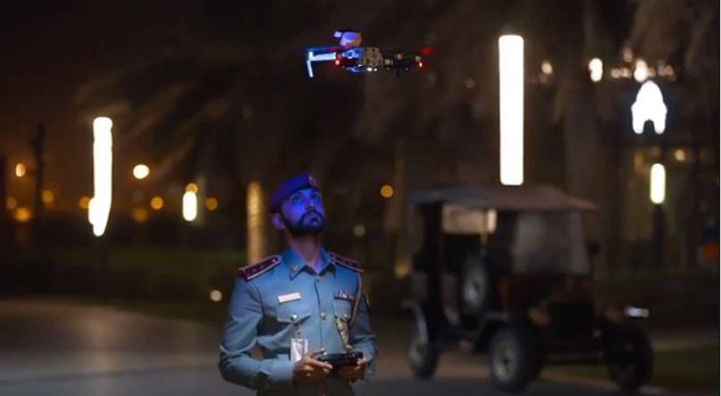 An officer launches a drone in Sharjah on Monday evening. The devices urge the public to stay at home to reduce the spread of the virus. Courtesy: Sharjah Police
