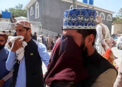 Relatives of victims of the Mastung explosion wait outside a hospital in Quetta, Pakistan. EPA