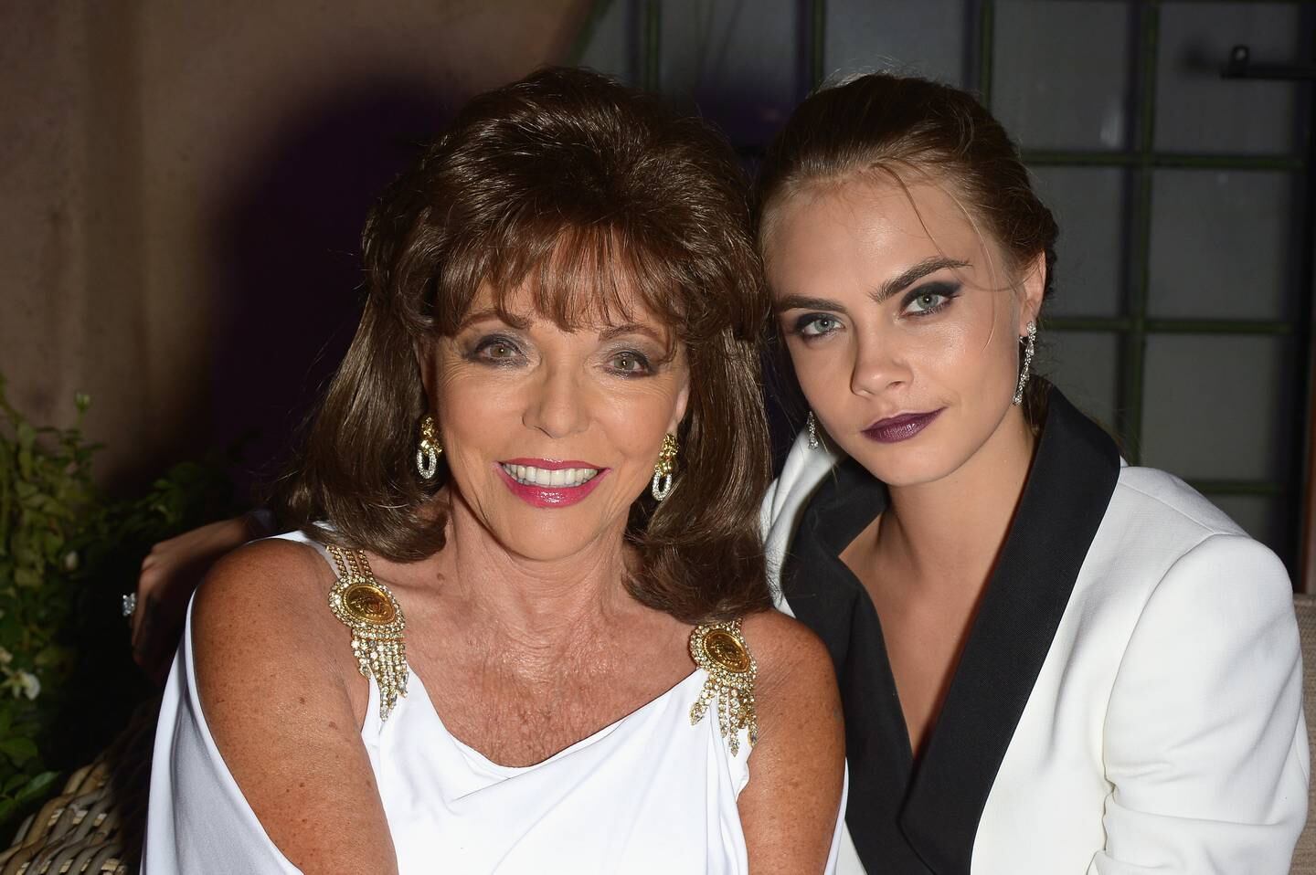 Joan Collins and Cara Delevingne. Getty Images