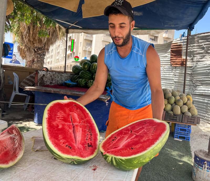 A man selling watermelons in the shade. Ghaya Ben Mbarek / The National